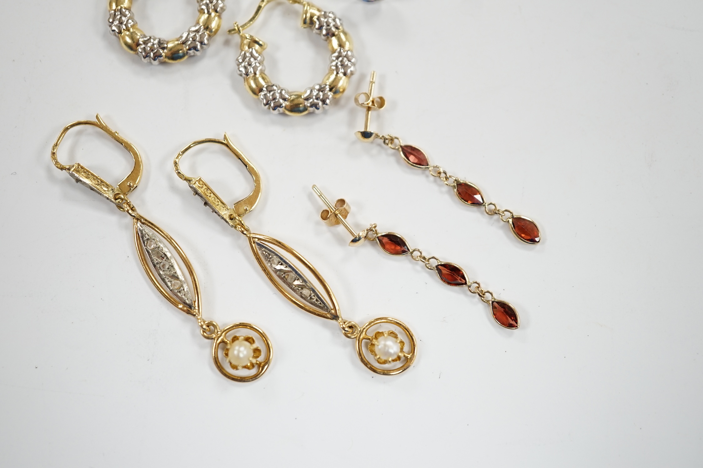 A pair of French 18k and cultured pearl drop earrings, 45mm and three other pairs to include 14k and diamond cluster, 9ct and garnet drop and two colour 10k.